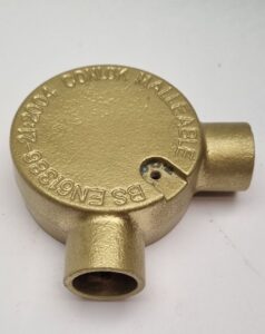 20mm brass angle box showing rear view for surface-mounted electrical conduit.